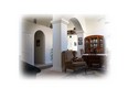 Arched hallways lead you to family room & kitchen...